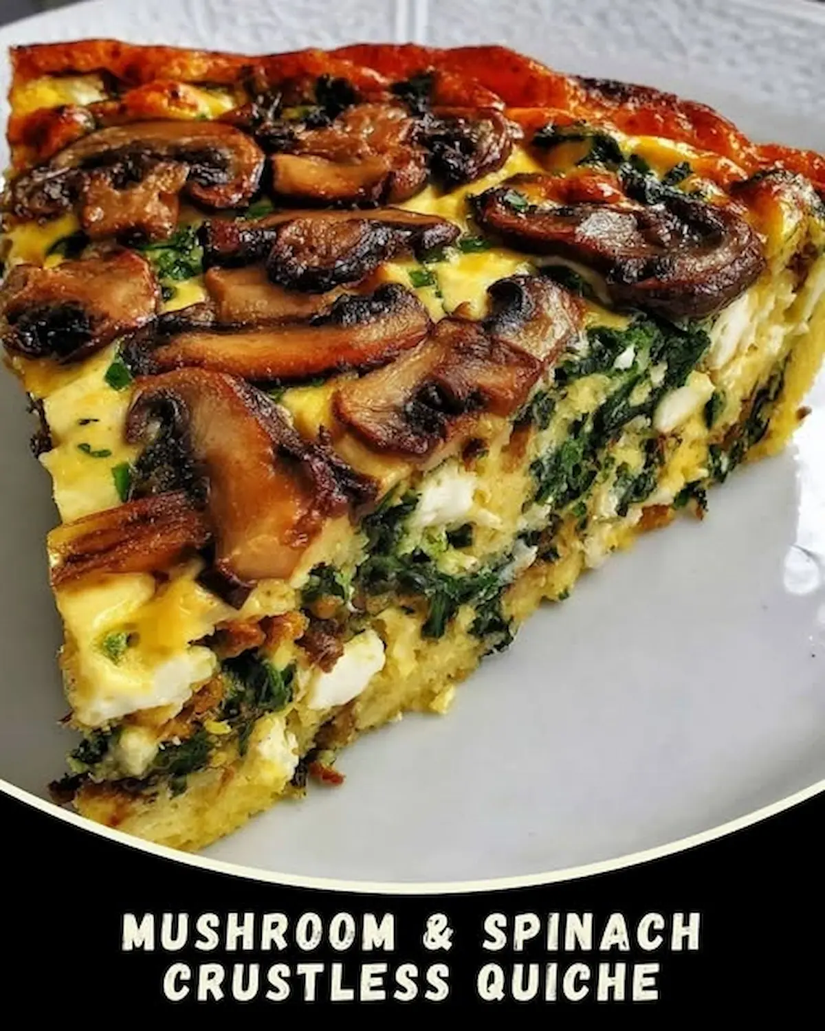 Slice of crustless mushroom and spinach quiche with golden top